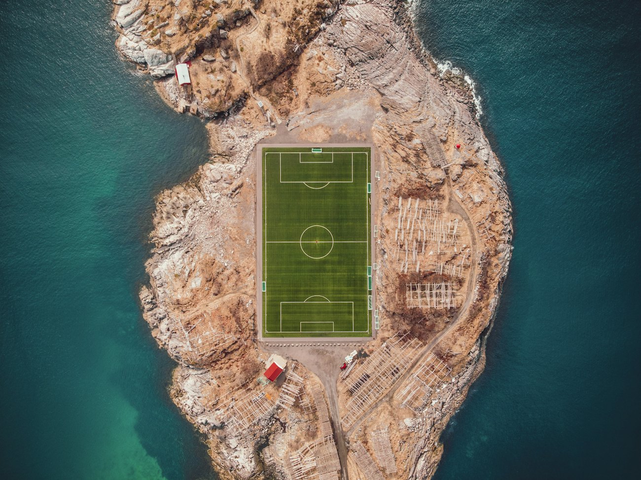 The football pitch on a rocky islet at Henningsvær in Lofoten, seen from directly above